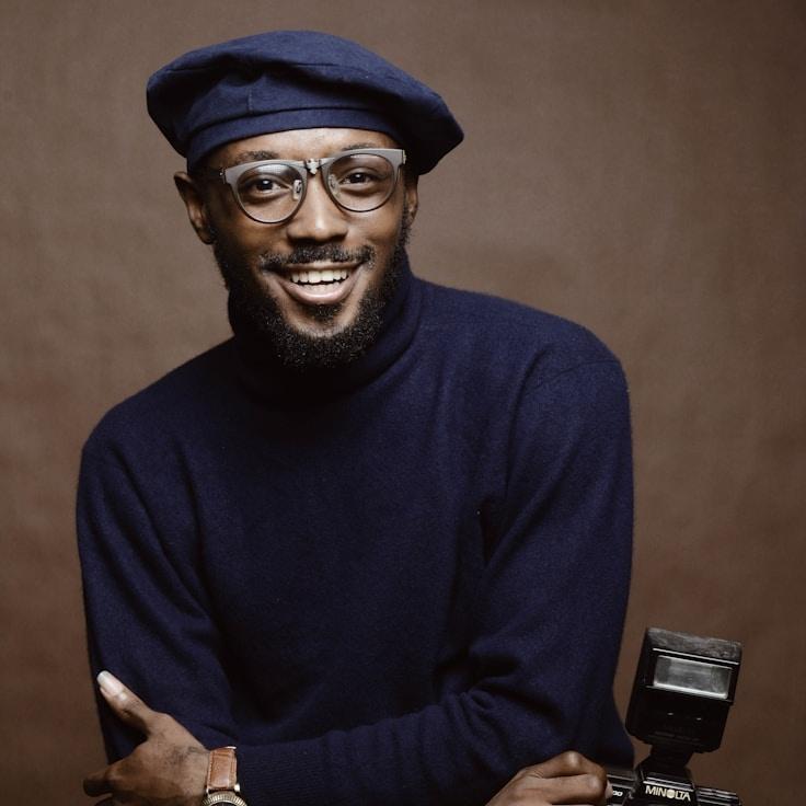 Kaveri Mehta, Lead Design Curator at SolidMeadowCafe, reviewing corporate floral arrangements